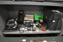 A selection of camera equipment including a Fujica ST605, an Olympus XA1, and Olymous Newpic 600,