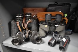 Four sets of binoculars. A swift Audubon 8.5x44 extra wide, a Swift Audubon 8.5x44, a pair of Barr &