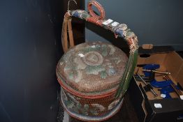 A Chinese styled woven fibre basket decorated with flowers and foliage