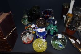 A selection of art glass and Murano style paper weights including tear drop designs and fish themed