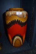 A substantial piece of mid century German pottery having fat lava glaze with orange and red colour