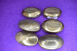 Six late Victorian brass cast snuff or pill case including Welsh interest