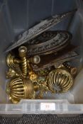 A box of vintage brass amongst which are four embossed plaques having phrases and sayings, chargers,