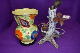 A ceramic lamp base with tree and bird decoration by Geobel West Germany and a Wades hand