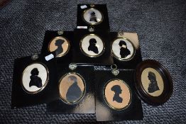 Seven miniature profile portraits having ebonised frames with brass details and similar oval form