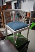 A Victorian style corner chair having later painted turned frame and blue upholstered seat