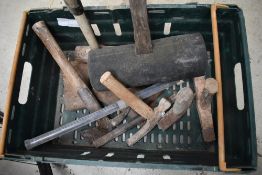 A selection of masonry hammers and chisel including pick axe
