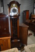 An oak cased long case clock reading tempus fugit