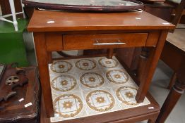 A modern MDF square coffee table with frieze drawer