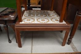 A vintage teak tile top square coffee table