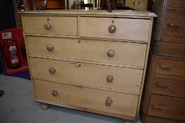 A stripped pine chest of two over three drawers, width approx. 116cm