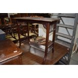 A Victorian hallway side table having carved mahogany frame with turned gallery supports