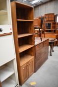 A hardwood modular bookshelf having double under cupboard