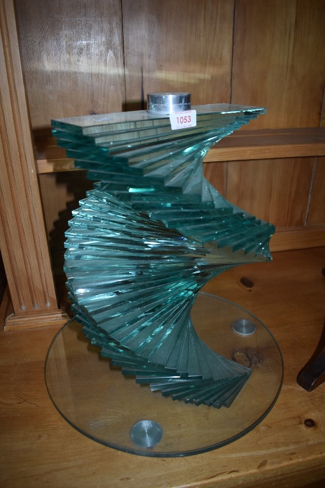 A laminated glass plant or similar stand