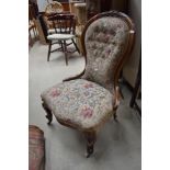 A late Victorian carved mahogany framed nursing chair