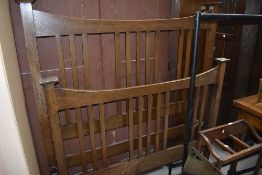 An early 20th Century oak bedstead