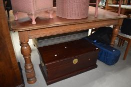 A Victorian oak dining table or desk having leather inset top, turned legs, approx. Dimensions 166 x