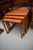 A vintage teak G plan nest of three tables