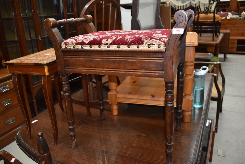 A late Victorian mahogany piano stool having turned frame