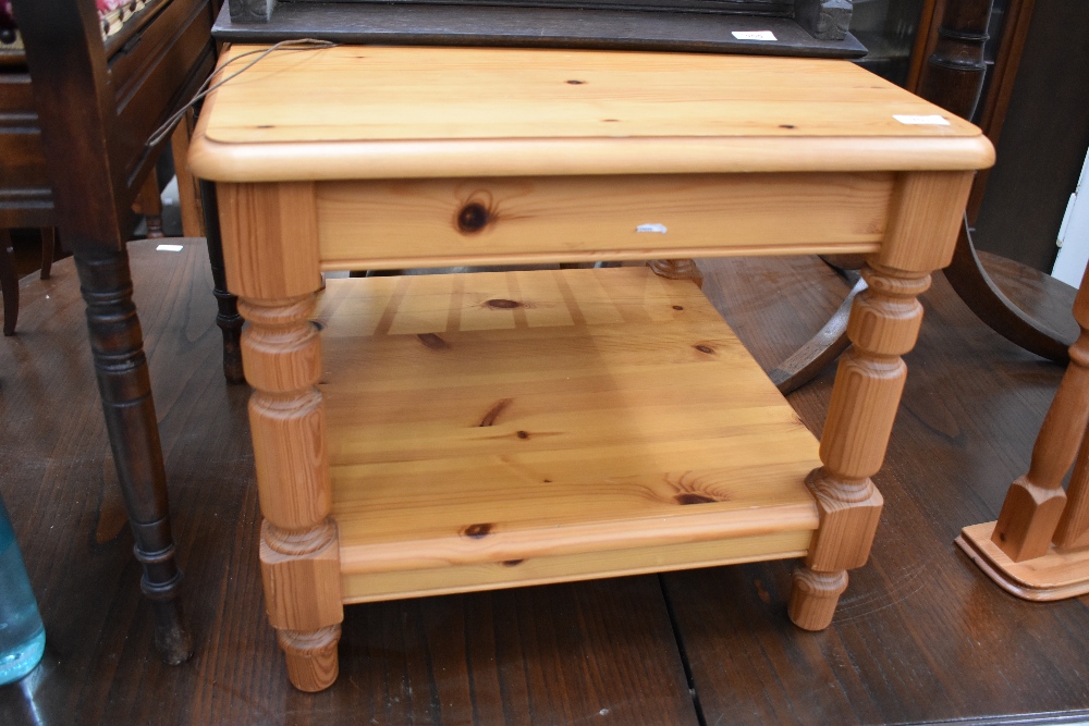 A pine coffee table, labelled Ducal, approx. 53cm x 53cm