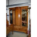 An early Edwardian wardrobe and dressing table both having fine inlay details and tear drop handle