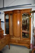 An early Edwardian wardrobe and dressing table both having fine inlay details and tear drop handle