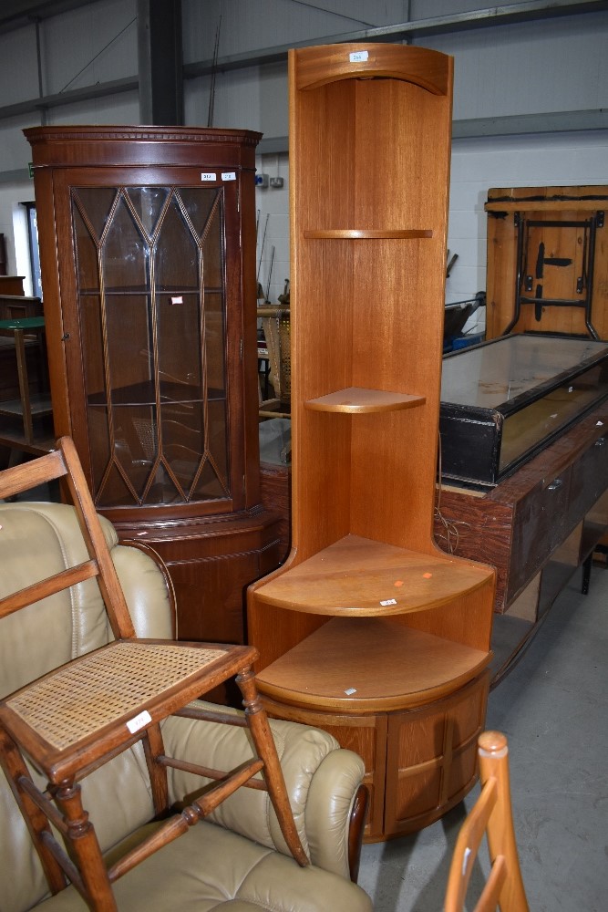 A mid century corner shelf and cupboard unit by Nathan