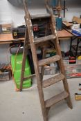 A set of vintage wooden step ladders