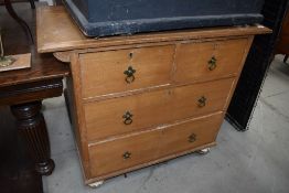 An Edwardian chest of two over three drawers in ash wood