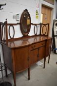 An Edwardian mahogany and inlaid sideboard having mirror back , on square tapered legs, width