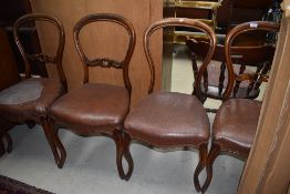 A set of four Victorian balloon back dining chairs (as found, one with damaged rail)