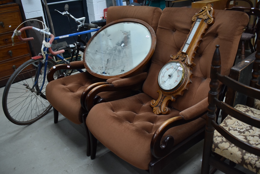 A pair of vintage scroll arm chairs, brown dralon