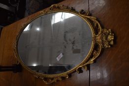 A vintage gilt framed wall mirror, approx. 66 x 39cm