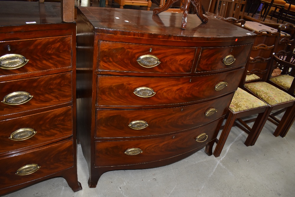 A 19th Century mahogany bow fronted chest of two over three flame fronted drawers, width approx.