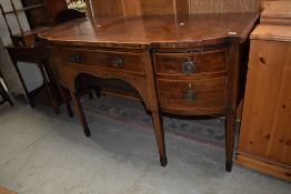 An Regency style side board having tapered legs with extensive inlay detailing