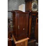 A late Victorian stained pine pot cupboard