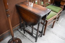 An early 20th Century oak gateleg table having barley twist frame