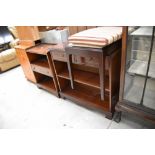 Two modern reproduction book shelves and a piano stool