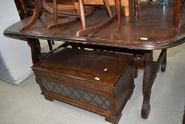 A late C20th oak effect dining table on refectory style base, approx 170cm, and a set of four
