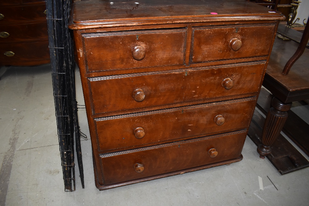 A late Victorian pine chest of two over three drawers having original turned wood handles