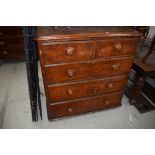 A late Victorian pine chest of two over three drawers having original turned wood handles