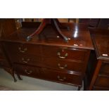 An Edwardian chest of two over two drawers with original brass handles