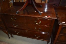 An Edwardian chest of two over two drawers with original brass handles