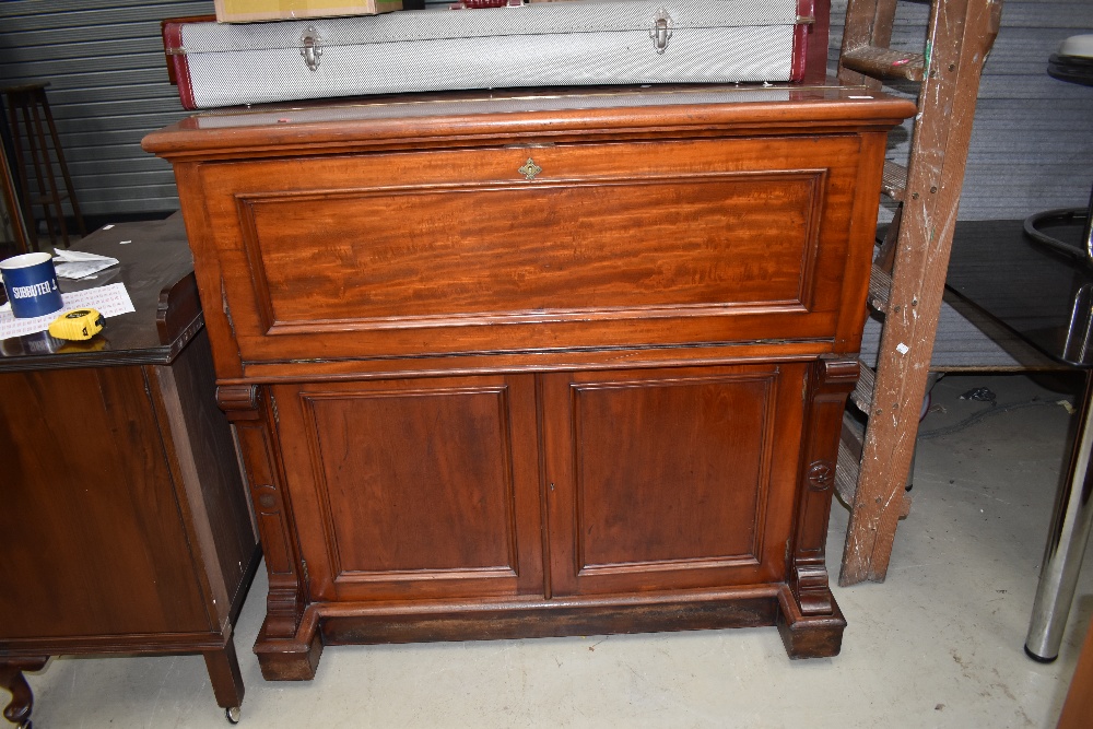 An impressive early Victorian mahogany secretaire desk having well fitted interior and double