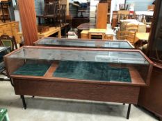 Two metal framed and glass fronted shop display cases or counters