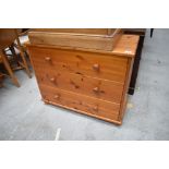 A chest of three pine drawers with matching handles