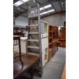 A set of traditional fold out pine step ladders