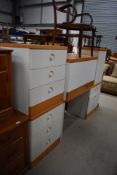 A selection of modern golden oak and white laminate bedroom furniture