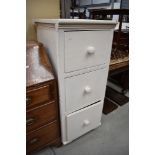 A set of office white painted yellow pine drawers with turned handles