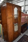 A 1920's walnut and mahogany mirror door wardrobe, approx w 103cm